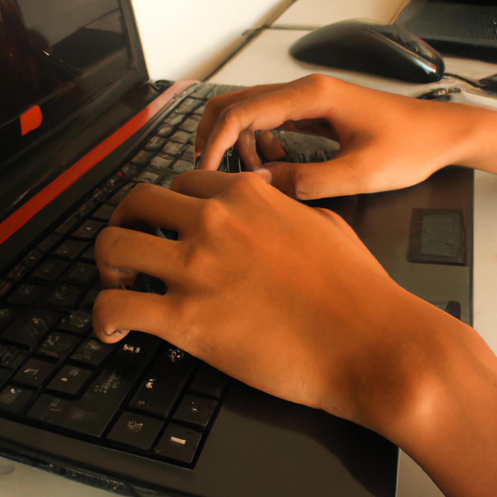 Person using computer, typing